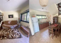 Sala de estar e cozinha integradas com escada de madeira — casa