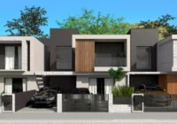 Fachada moderna de casas geminadas com carros na garagem