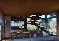 Sala integrada com cozinha e escada moderna — Villagio di Scaline