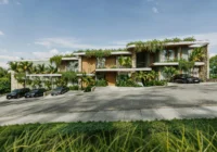 Fachada moderna do condomínio com vegetação exuberante — apartamento à venda Praia da Gamboa Garopaba